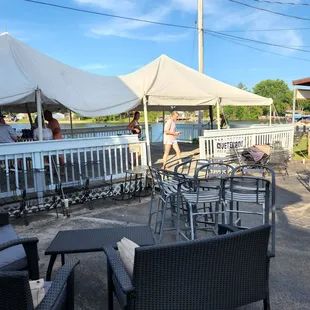 patio area with tables and chairs