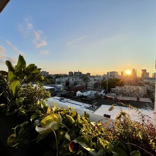 the sun setting over the city