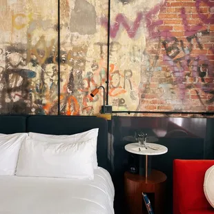 Original graffiti wall was maintained in this corner suite!