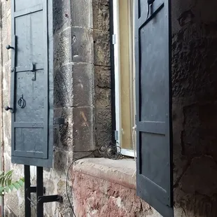a window with shutters open