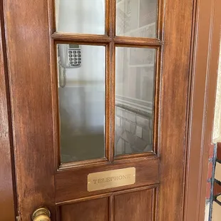 Telephone booth with actual telephone
