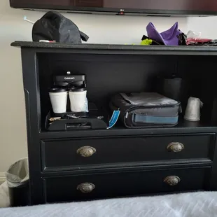 The coffee maker has to be moved to use it to the only place in the room with sockets, one of the bedside tables.