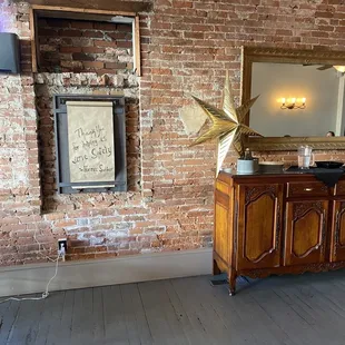 Love the exposed original brick wall &amp; decor