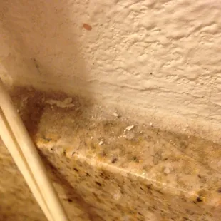 Thick dirt right next to the sink.  HOW HARD IS IT TO CLEAN A SINK!