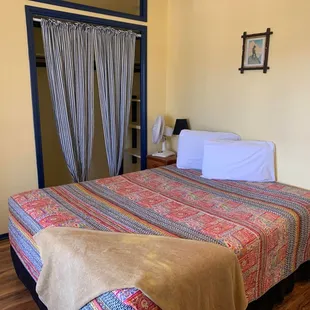 Queen bed, shared bathroom, balcony access! Coffee and free wifi in every room!