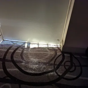 Gap under the door, wind blows in, sun shines in. Cold and Drafty.