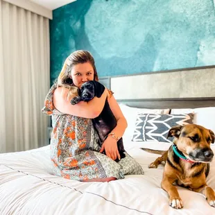 You can snuggle with the pups on the bed For no additional fee