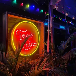 a neon sign for a mexican restaurant