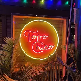 a neon sign for a mexican restaurant