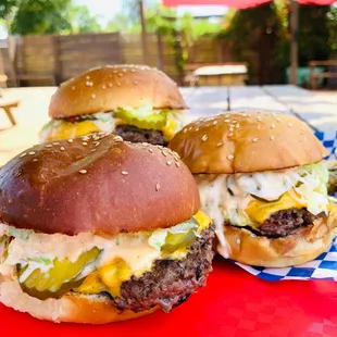 Vegas Burger: 1/4lb patty, Vegas sauce, lettuce , cheese, pickles, onions on a Sour Duck bun