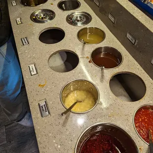 They charge $3 per person for access to this basic sauce bar