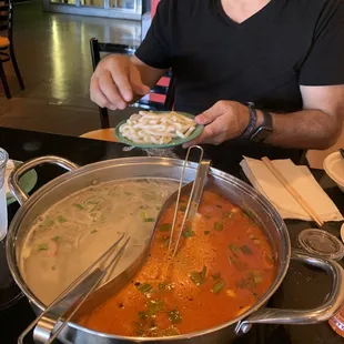 Vegetarian broth on the left and Tom Yum on the right. Delicious