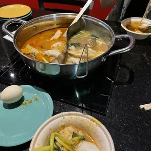 a bowl of soup with a spoon in it