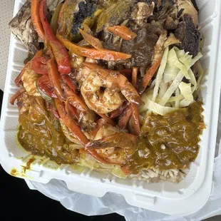 Jerk Chicken and Shrimp with curry sauce on top