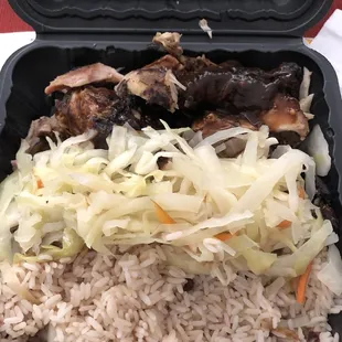 Jerk chicken, rice and peas, steamed cabbage