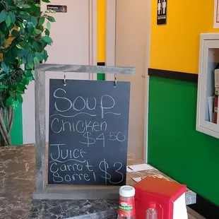 a table with a chalkboard sign