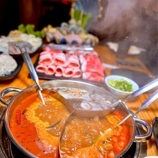 a hot pot of food on a table