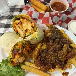 Buffalo Fried Chicken Wrap with Chili Cheese fries (shredded cheese instead of nacho cheese sauce) Their Chicken Fingers are the BOMB.com