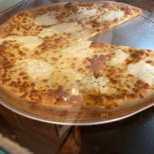 4 cheese pizza. Slices or they will make you a whole pie. Great late night pizza that's open up til 3am depending on the night.