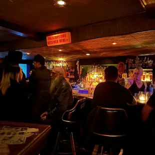 people sitting at a bar