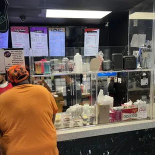 a woman standing at a counter