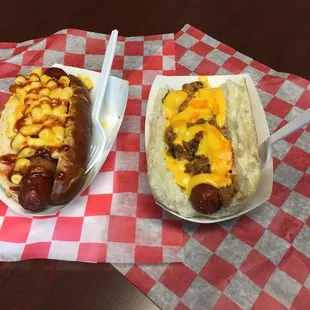 Huge dogs!  'Courtney' on left is bacon wrapped with mac.  'Al's' is on right with pulled pork a cheese