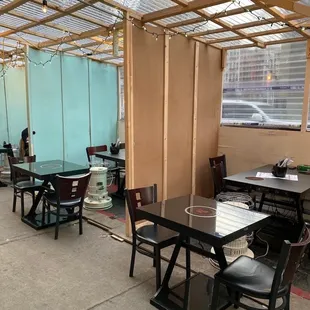 a dining area with tables and chairs