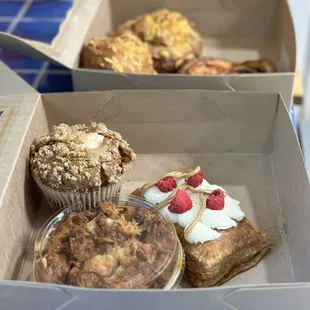Sweet baked goods, including monkey bread, raspberry peanut butter thing, and an apple cream muffin.
