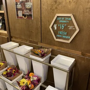 a display of buckets of flowers