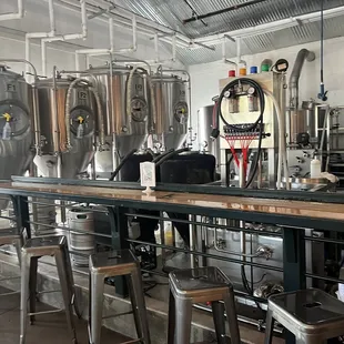 Brewery set up with some barstools right when u walk in the front door