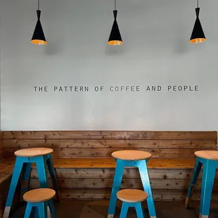 a row of stools and tables