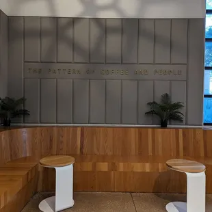 two benches in front of a wall