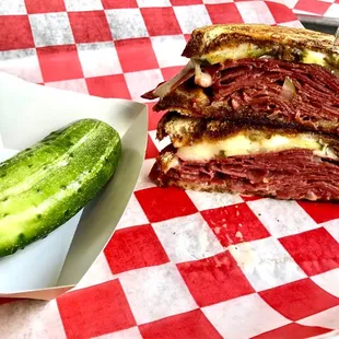 Houndstooth Rueben sandwich with Sour Pickle side