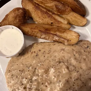 Delicious Chicken Fried Steak with (too salty) gravy and JoJo potatoes
