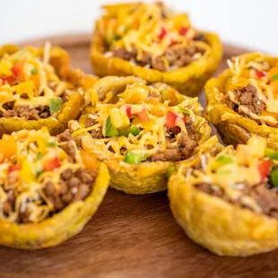 a plate of mini taco cups