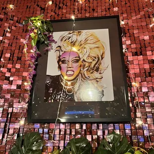 a portrait of a woman surrounded by flowers