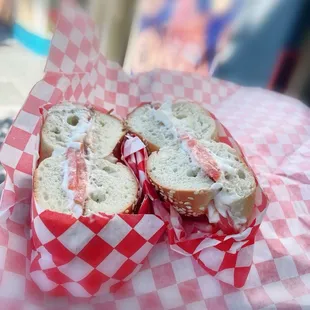 Sesame Bagel with cream cheese and tomato.