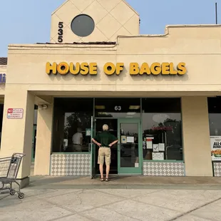 a man standing in front of a store