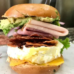 Bagel  Bacon  egg  and cheese added Turkey, Ham, Avocado  lettuce  and red onions ! Yummy