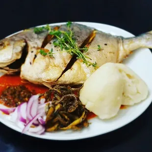 a plate of fish and vegetables