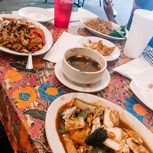 a variety of dishes of food on a table
