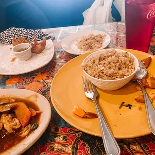 a plate of food and a bowl of rice