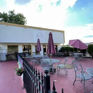patio area with tables and umbrellas