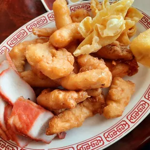 Combo lunch (bbq pork, sweet and sour chicken, crab puffs) $11.95