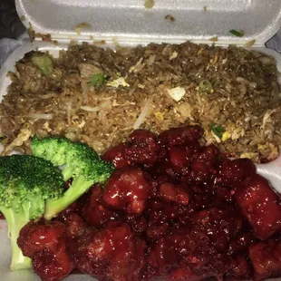 a container of food with broccoli