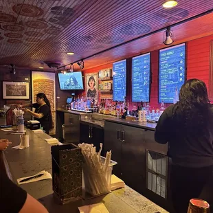 people sitting at the bar