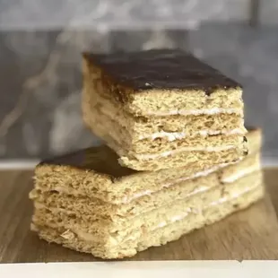 a stack of cake on a cutting board