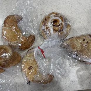 a variety of pastries wrapped in plastic