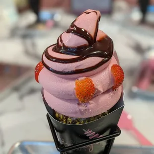 Build your own Dole Whip Strawberry with chocolate syrup in pistachio chimney cake