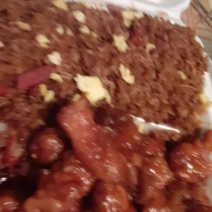 a plate of meat and rice